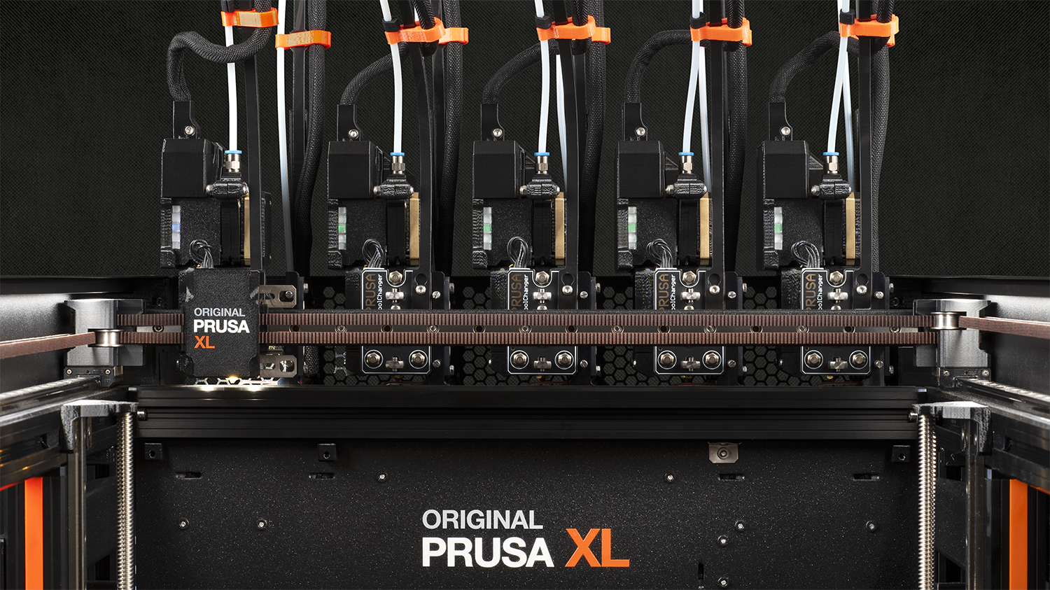 Five Prusa XL Nextruders next to each other on the printer